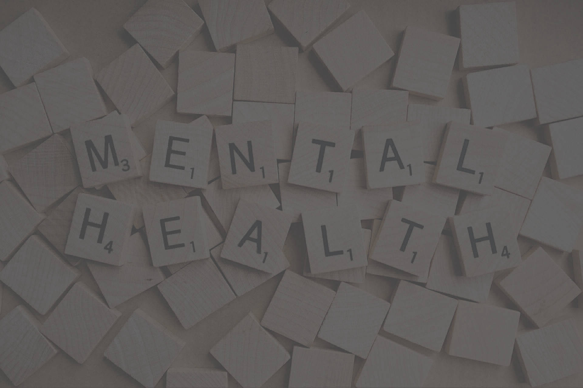 Image of wooden block letters spelling mental health